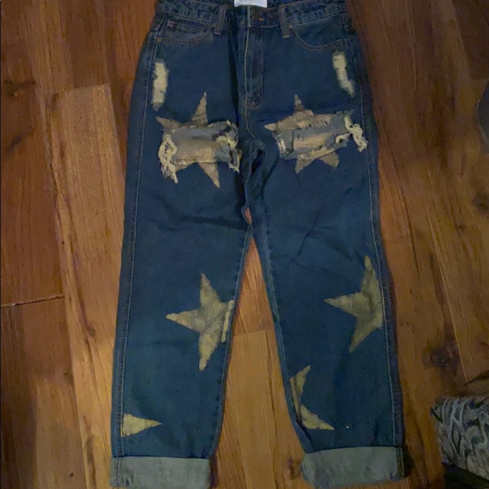 Blue jeans with spray painted gold stars